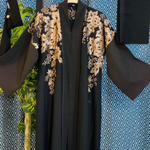 Black Dubai abaya with earthy-tone floral embroidery on shoulders and sleeves