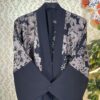 Black Dubai abaya with earthy-tone floral embroidery on shoulders and sleeves