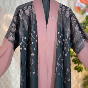Dubai embroidered abaya in deep green with dusty rose panel and elegant leaf embroidery