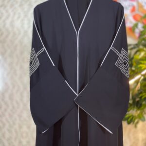 Elegant black Dubai abaya with double-layer sleeves featuring golden and transparent stonework