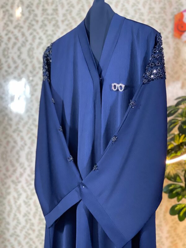 Elegant navy blue Dubai abaya with black crystal beadwork on sleeves and back